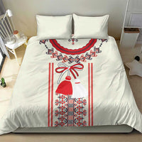 Light beige bedding set with red and blue Romanian folk girl motif on duvet and pillow