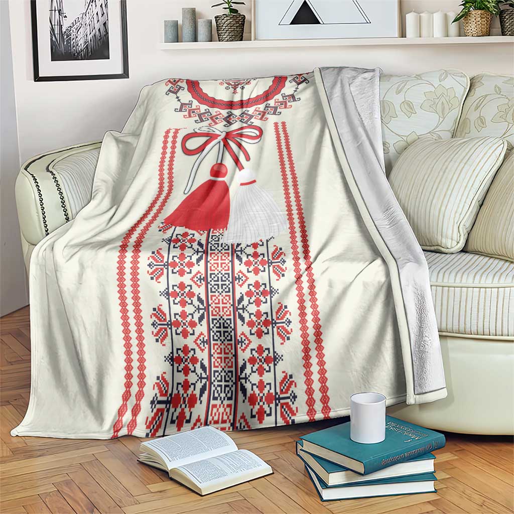 Traditional Romanian folklore blanket with red and blue figure pattern on light background