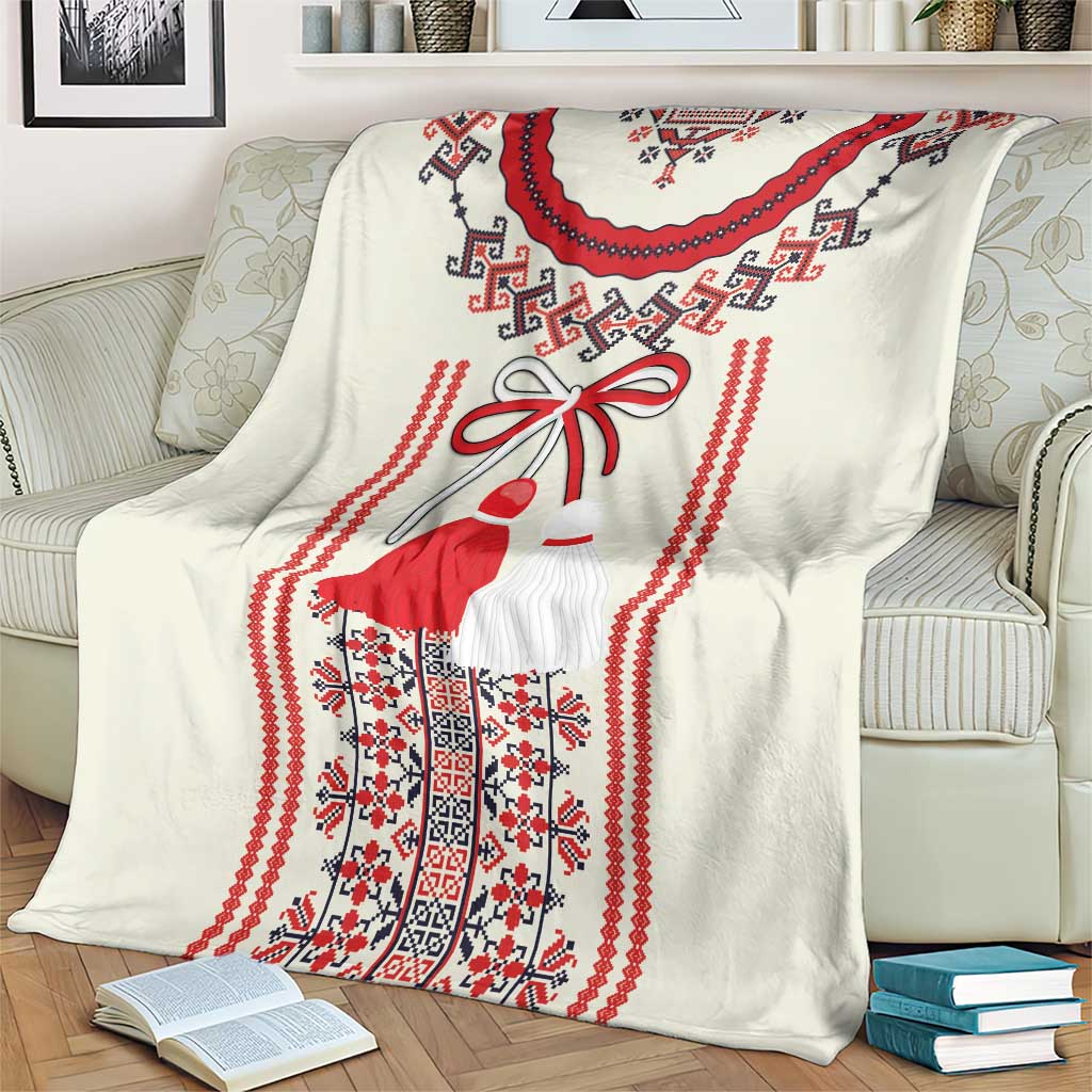 Romanian folk blanket draped over armchair with red dress figure and braided border pattern