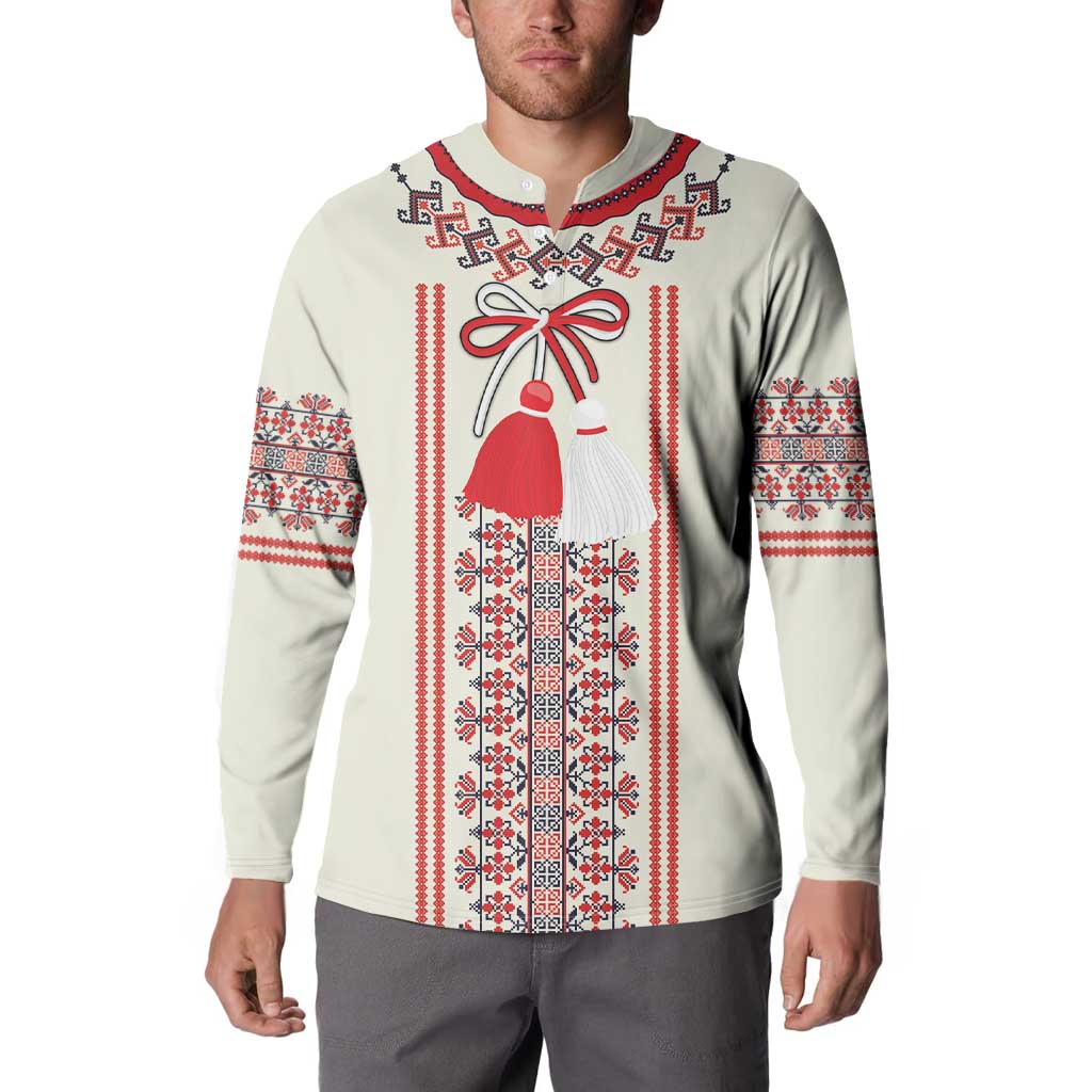 Beige long-sleeve sweatshirt on model with red, white, and blue folk panel and bell figure print