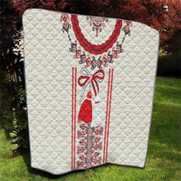 White quilt with quilted diamonds and central Romanian folk dress motif in red and black
