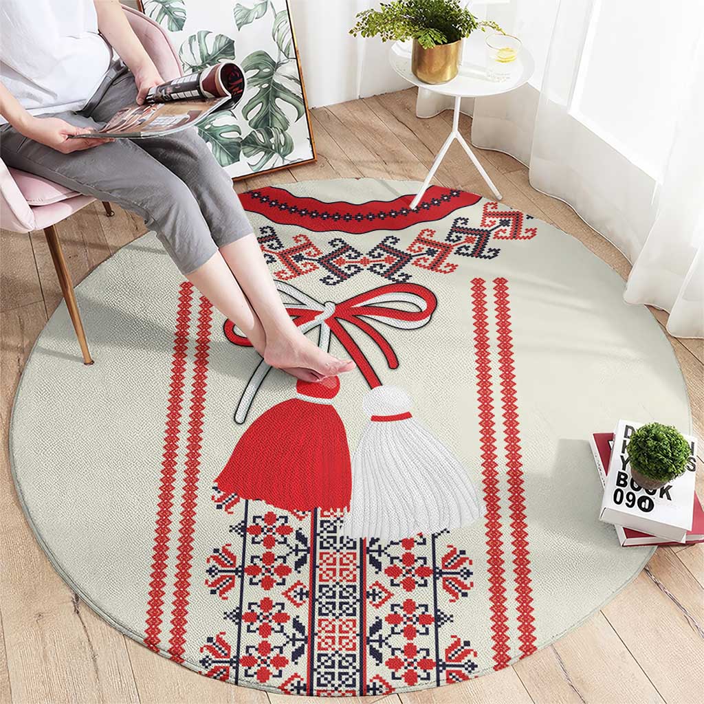 Beige round carpet with red and white folk border and costumed girl motif