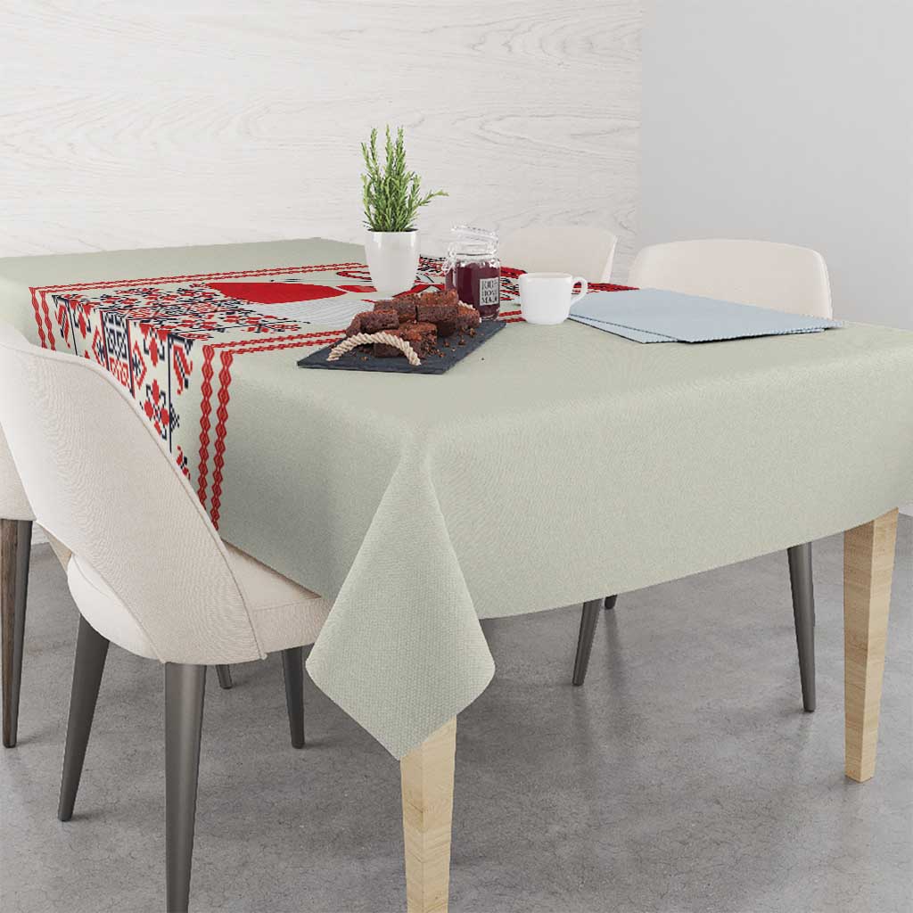 Beige tablecloth with red folk runner design and patterned side border