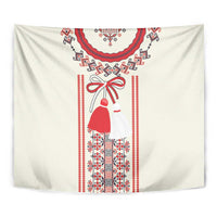 Beige wall tapestry with central red bell figure, bow and geometric Romanian stripes