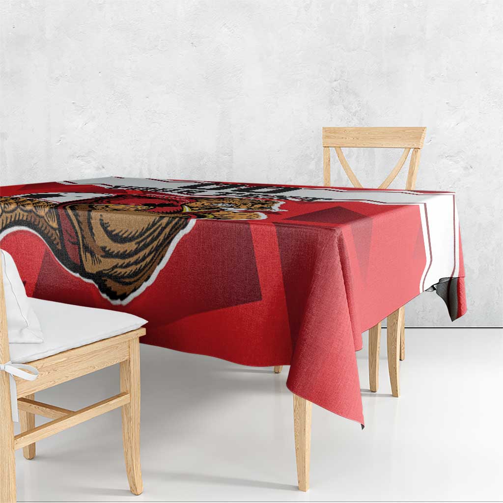 Red football tablecloth with beaver mascot pattern, neatly spread on dining table