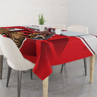 Red football tablecloth with beaver mascot graphic, draped over dining table