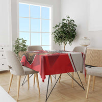 Red football tablecloth with beaver mascot graphic on dining table