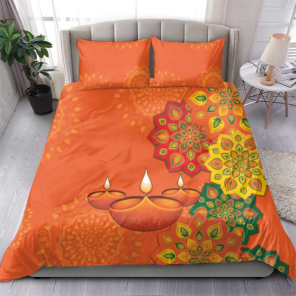 Orange bedding set with rangoli mandala design, candles motif, and two square throw pillows