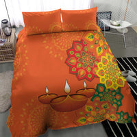 Orange bedding set featuring rangoli medallion, leaf patterns, and two matching pillow shams