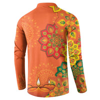 Orange button sweatshirt with rangoli mandala and diya candle patterns on back