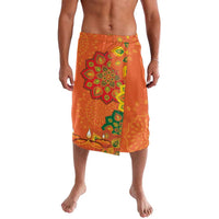 Orange lavalava skirt with green and yellow rangoli-style patterns