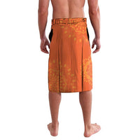 Orange lavalava sarong with subtle green and gold circular pattern, back view