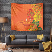 Saffron orange Diwali tapestry with rangoli mandalas, green accents, and diya lamp motif