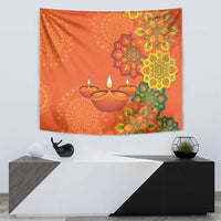 Saffron orange Diwali tapestry with diya lamps and colorful rangoli flower pattern