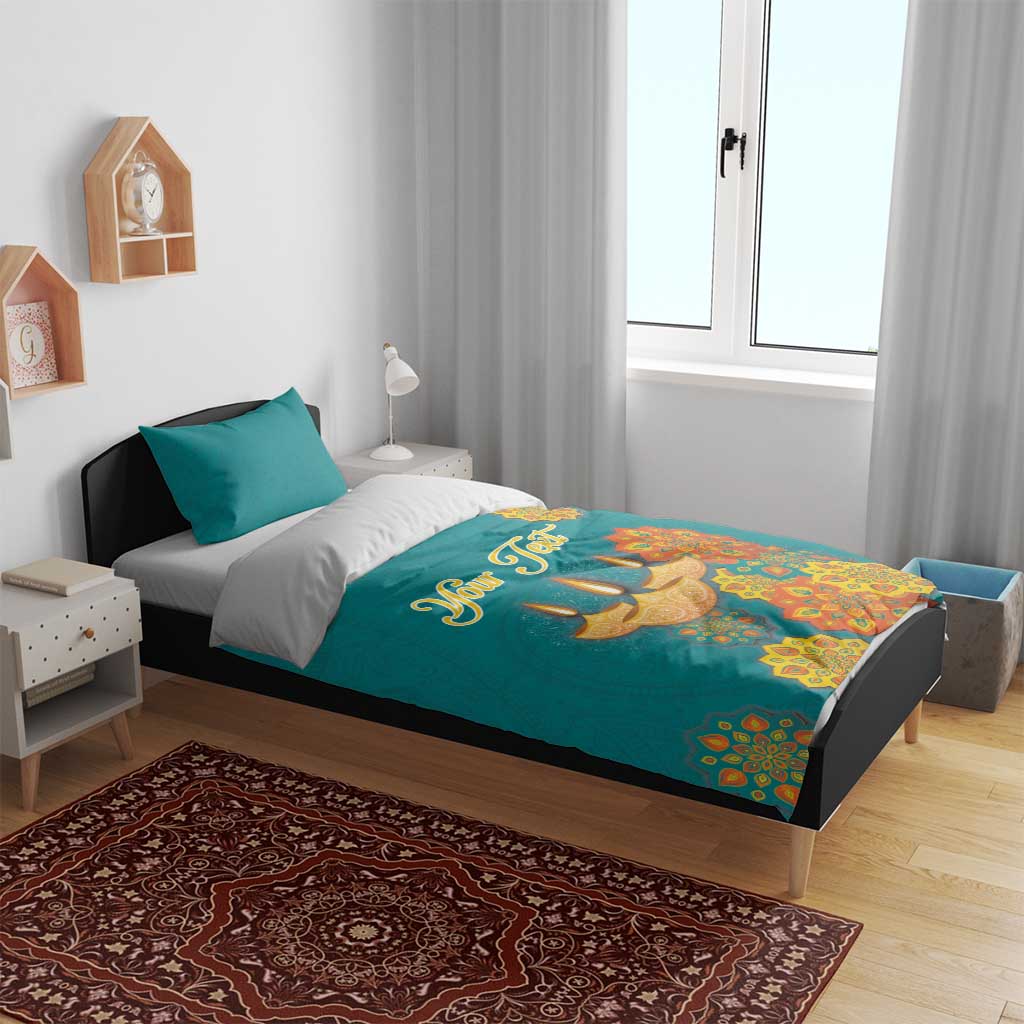 Teal bedding set with “Your Text” and Diwali diya and floral mandala graphic