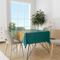 Teal Diwali tablecloth with orange and yellow medallion designs across the surface