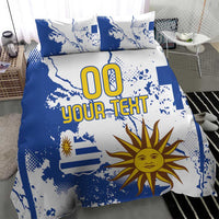Blue and white bedding set with Uruguay map and sun motif on duvet cover