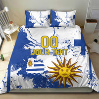 Blue and white bedding set featuring Uruguay flag map, sun graphic, and 'YOUR TEXT'