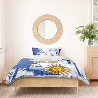 Blue and white duvet and pillow set with Uruguay map and sun motif centered