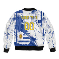Back view bomber jacket with black ribbed waistband, blue map graphic, YOUR TEXT and 00