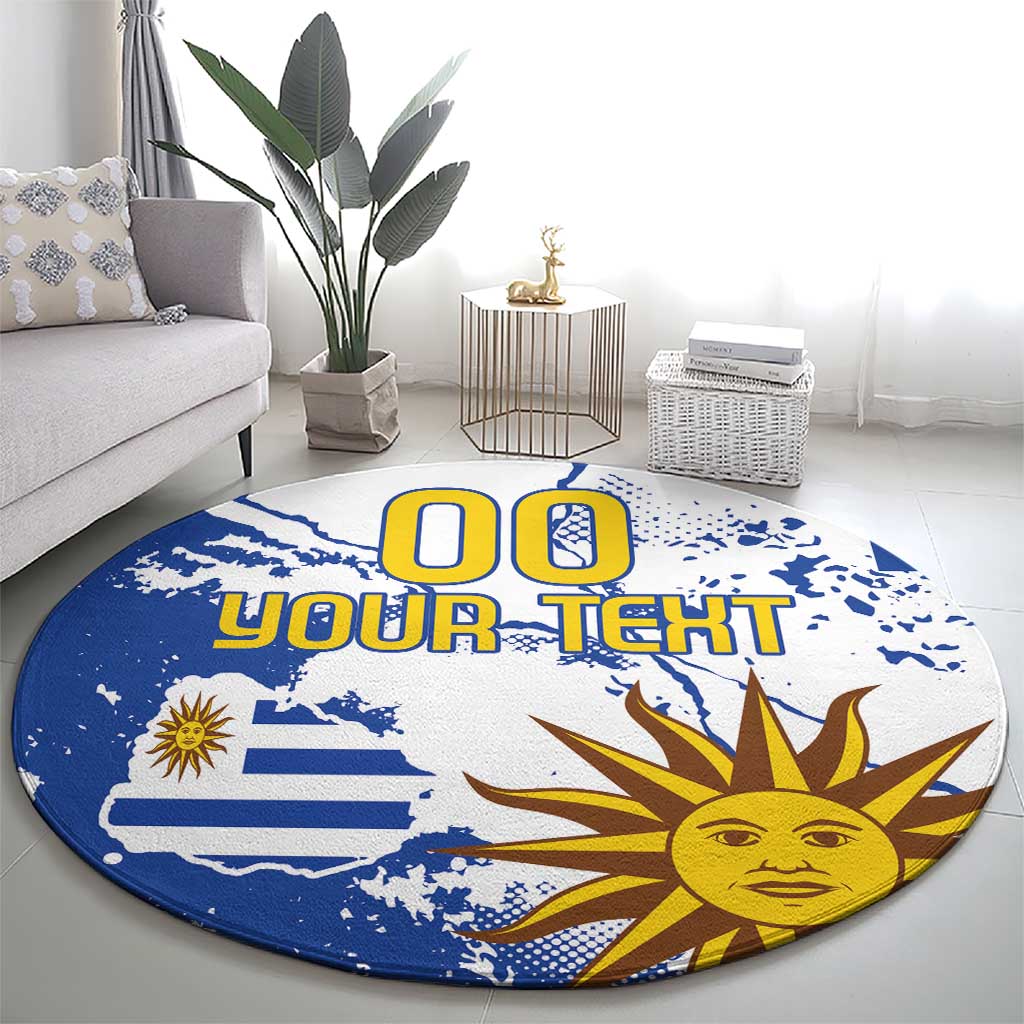 Round blue area rug with Uruguay flag and sun graphic, custom text in center