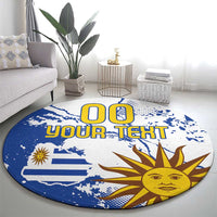 Round blue area rug with Uruguay flag and sun graphic, custom text in center