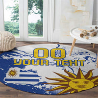 Round blue area rug with Uruguay flag and sun graphic, custom text centered