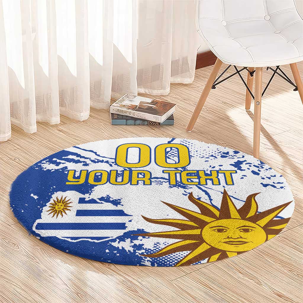 Round blue area rug featuring Uruguay flag, sun face graphic, and custom text