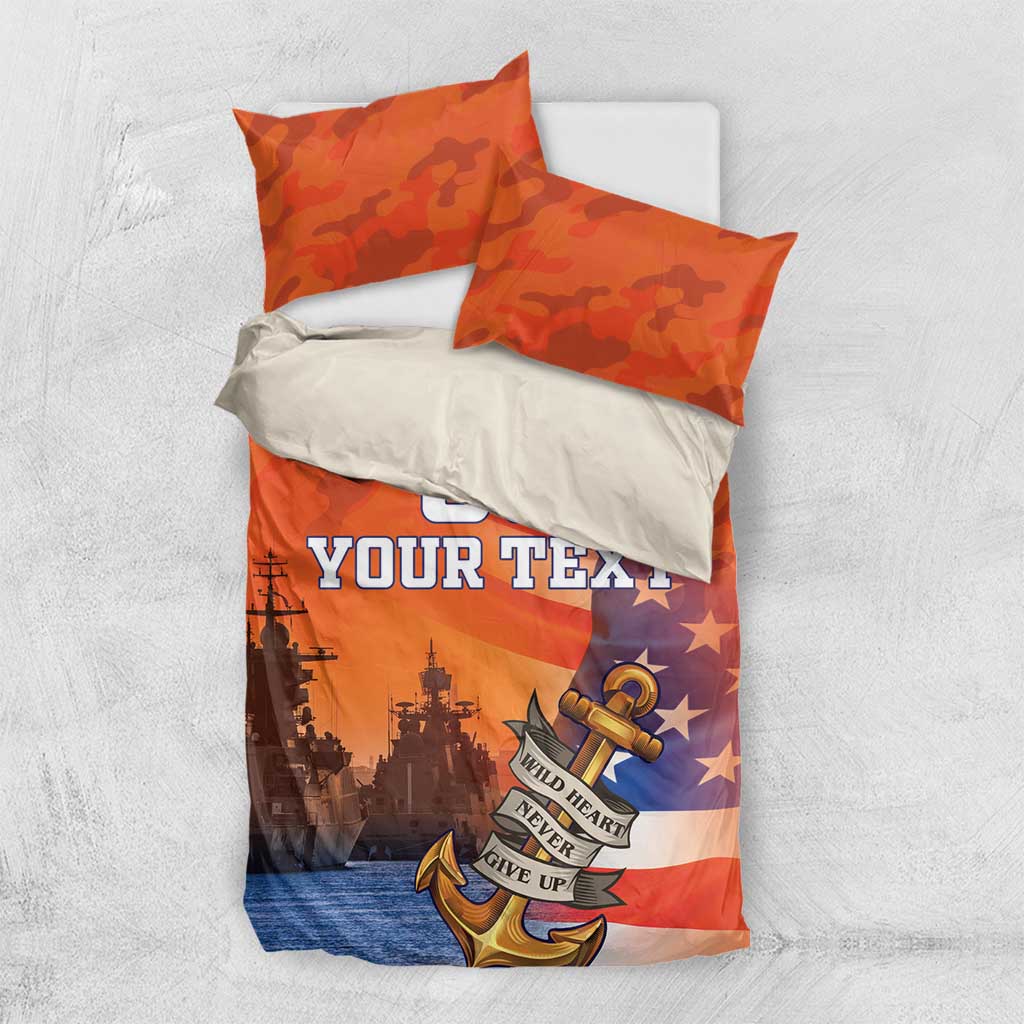 Orange camo duvet and two pillows with anchor, stars, and ship silhouettes