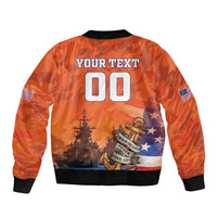 Orange bomber jacket with black rib trim, US flag sleeves, back graphic with large 00