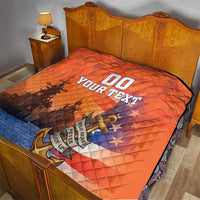 Orange and blue quilt on a bed, diamond stitching with ship silhouette and “YOUR TEXT”