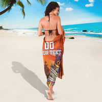 Orange camouflage sarong with anchor, ship silhouette, stars and 'YOUR TEXT' print