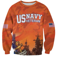 Orange camouflage sweatshirt with US NAVY VETERAN front graphic, ship and cannon