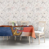 Orange US Navy veteran tablecloth with camouflage pattern and anchor artwork on table