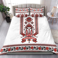 White bedding set with red/black folk trident panel, matching pillow covers, and border