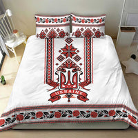 White bedding set with central trident 'UKRAINE' and red/black patterned frame