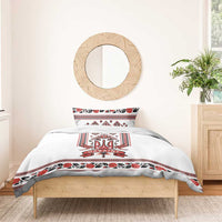 White duvet cover with red/black folk trident 'UKRAINE' panel and striped border