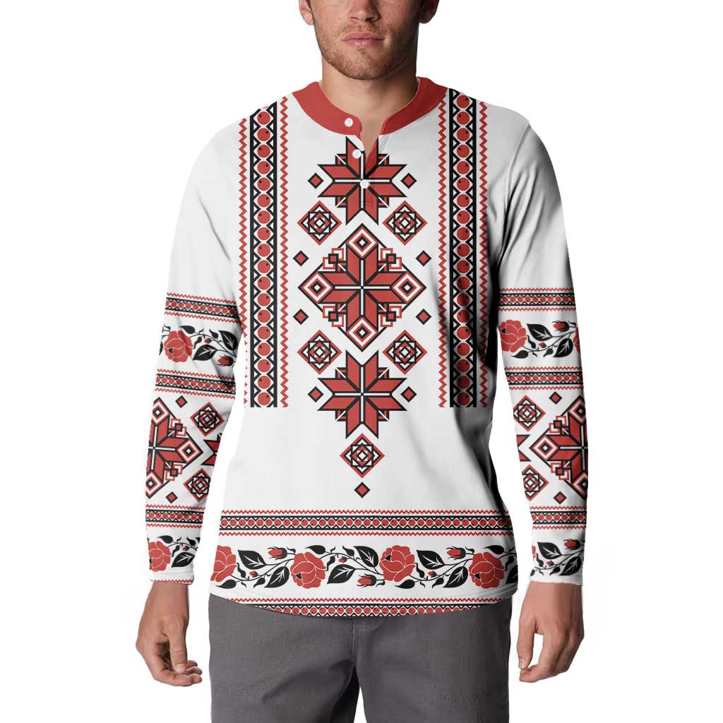 White crewneck sweatshirt with red collar, folk embroidered panel and patterned sleeves