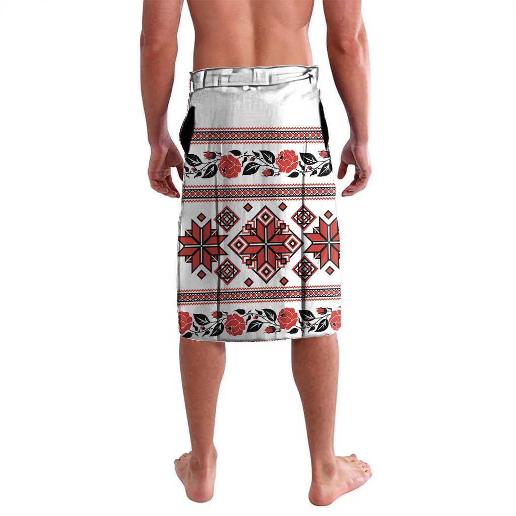 White folk-print shorts with red and black geometric bands and floral motifs