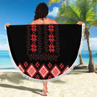 Round beach blanket with black and red folk print and white fringe trim
