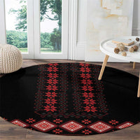 Round black carpet with red folk stripe and diamond motifs