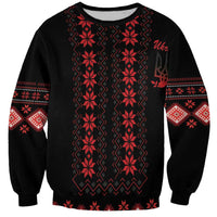 Unisex crewneck sweatshirt in black with red folk stripe panel and sleeve motifs