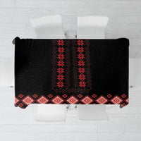 Black tablecloth with red geometric folk patterns and diamond border