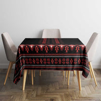 Black and red geometric tablecloth covering dining table with chairs