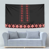 Black tapestry with red vertical embroidery and repeating diamond-pattern border strip