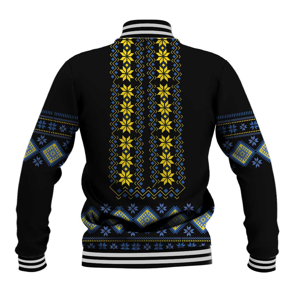 Black baseball jacket with yellow and blue folk pattern on back, striped cuffs and hem