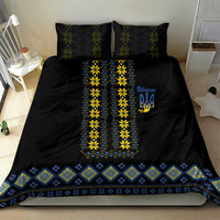 Black duvet cover with yellow and blue folk design center panel and matching patterned bottom border