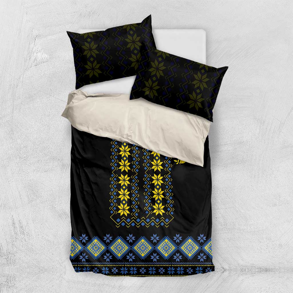 Black bedding set with yellow and blue folk embroidery panel; two dark pillow shams included