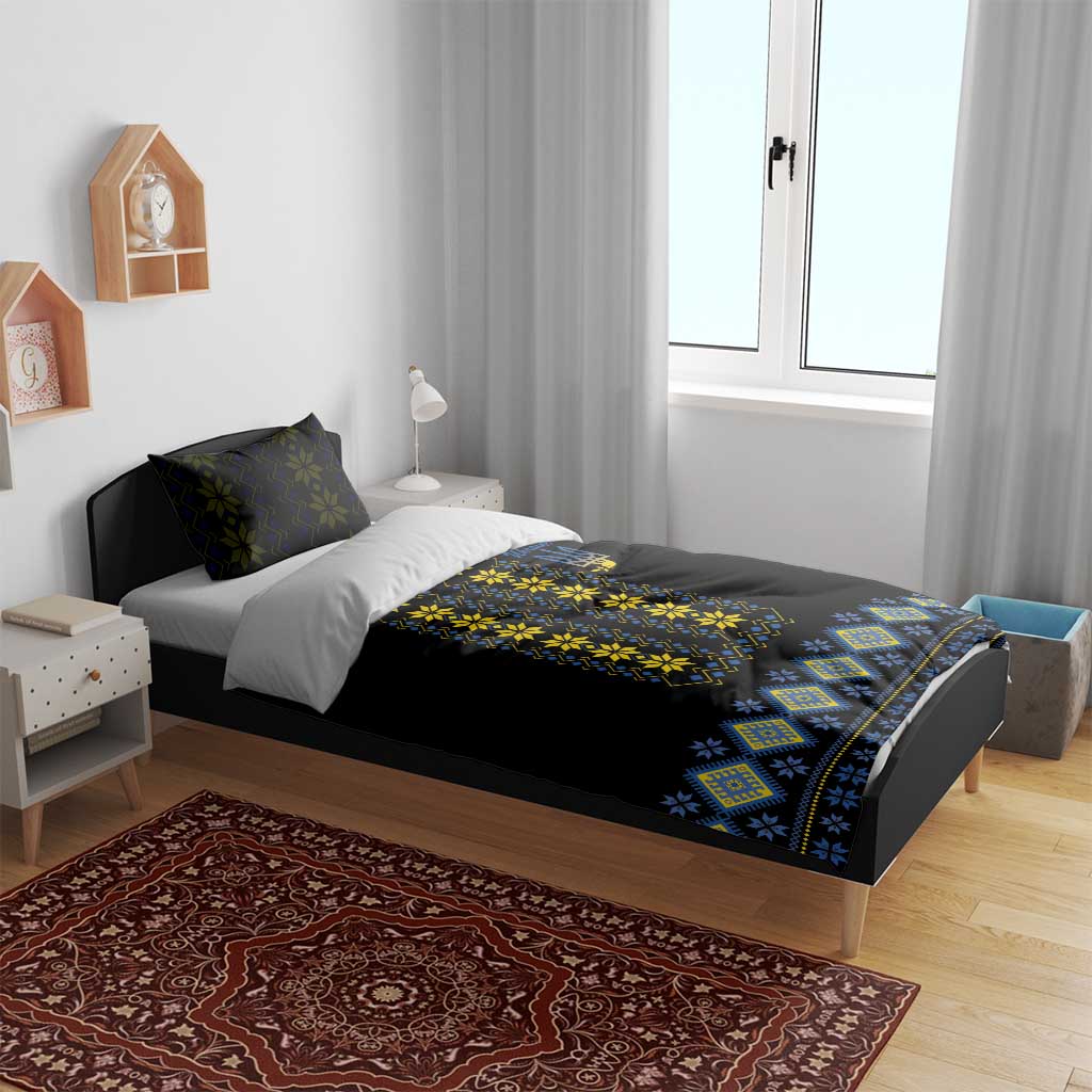 Black duvet cover with yellow and blue folk embroidery panel and matching patterned bed border