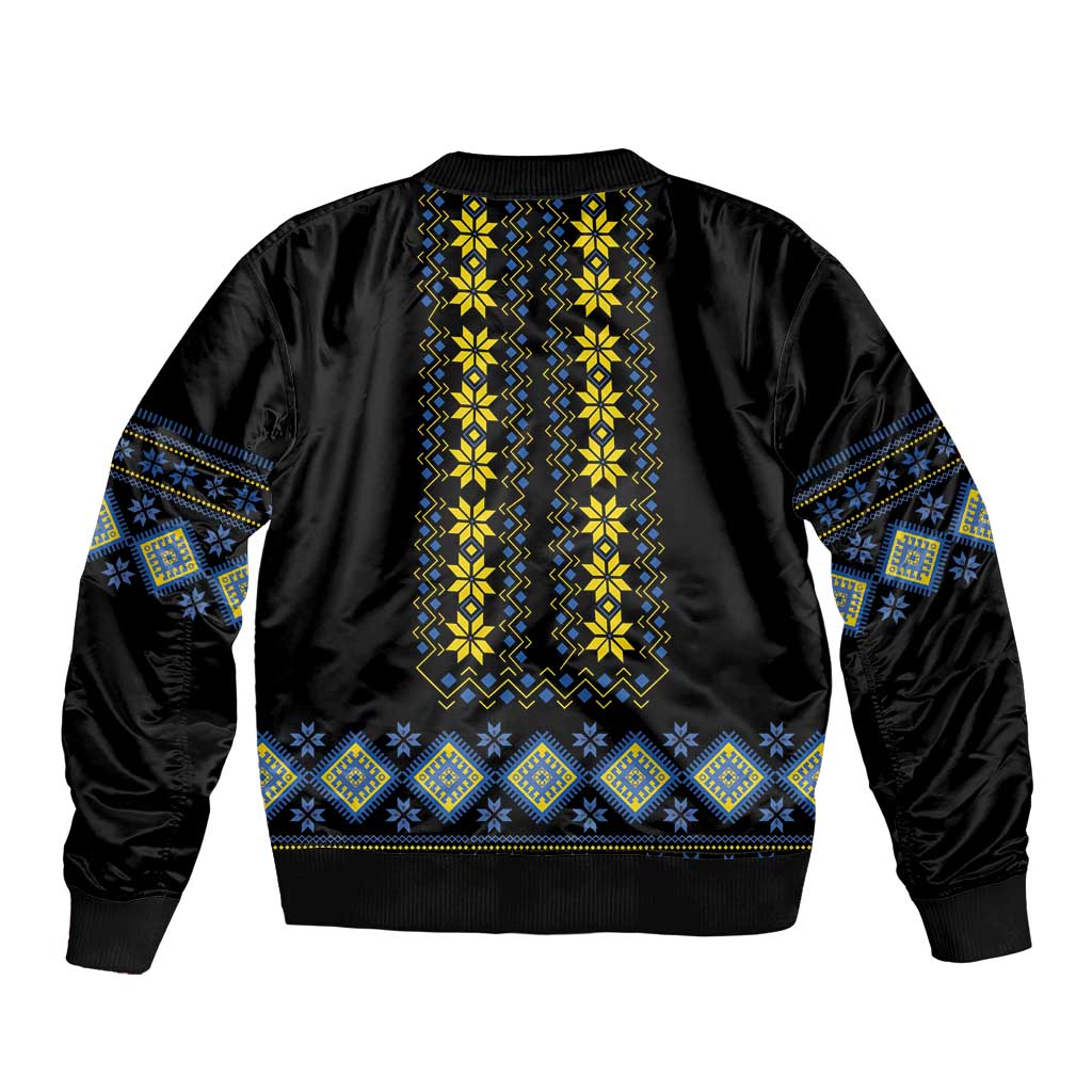 Black bomber jacket with yellow and blue folk stripe embroidery, ribbed hem